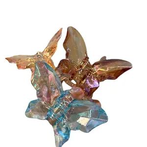 Pinces à cheveux papillon en cristal irisé couleurs ambre doré et bleu glacé