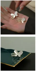 Macro view of silver butterfly hair clips with sparkling rhinestones and cat eye stones