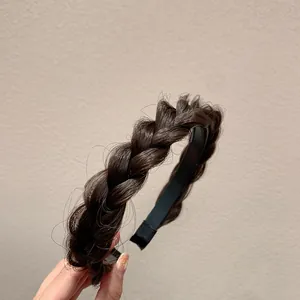 Detailed close-up of dark brown braided headband with realistic synthetic hair texture