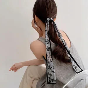 French lace floral hair scarf tied on a ponytail for a minimalist chic women accessory