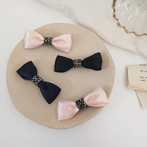 Elegant rhinestone ribbon bow hair clips set in black and pink satin for women