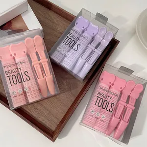 Detail of professional hair root volumizer set in pink and purple colors