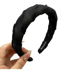Handmade black padded headband with glitter mesh fabric and high volume puffy design