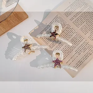 Lot de 3 pinces à cheveux crème élégantes avec motifs étoiles en strass sur livre ancien