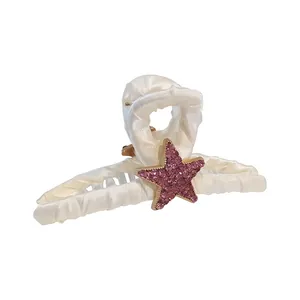 Pince à cheveux élégante en satin crème ornée d'une étoile scintillante en strass mauves