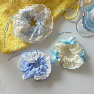 Three-piece lace ribbon scrunchies set featuring blue and white floral bow designs