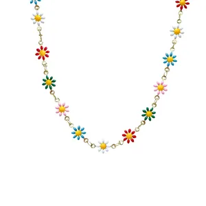 Colorful daisy pendant necklace with gold chain in a minimalist U-shaped arrangement