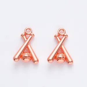 Close-up of rose gold baseball and crossed bats pendants for DIY jewelry making