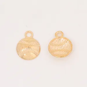Macro shot of double-sided baseball pendant charms in vintage gold for DIY jewelry