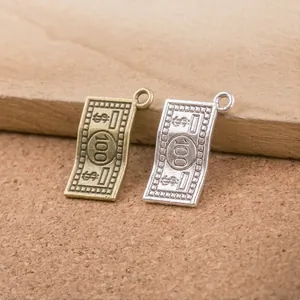 Macro detail of vintage alloy dollar bill pendants in bronze and silver finishes