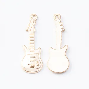 Detailed front and back view of light gold guitar shaped metal alloy charms for DIY jewelry