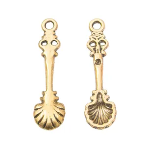 Vintage gold zinc alloy spoon pendants with intricate shell patterns for DIY jewelry