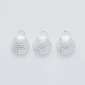 Detailed view of silver shell-shaped zinc alloy jewelry pendants for DIY craft projects