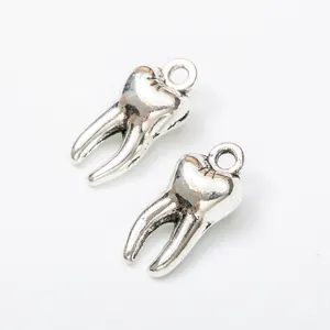 Set of two vintage silver alloy molar tooth charms with top hanging loops for DIY jewelry