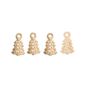 Detailed view of golden metal Christmas tree charms with embossed star and bead patterns