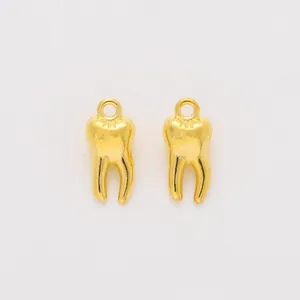 Pair of vintage gold alloy tooth pendants for DIY jewelry making and crafting
