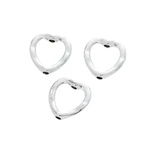Three vintage silver alloy heart-shaped beads with hammered texture for DIY jewelry making