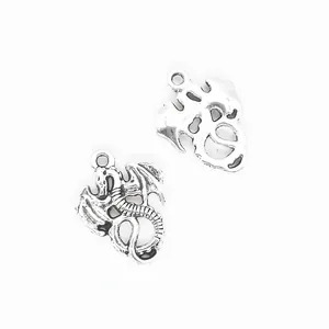 Vintage silver alloy dragon pendants for DIY jewelry with antique finish on white back