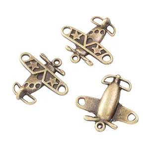 Set de tres colgantes de avión en aleación de zinc bronce vintage con estrellas