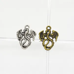 Macro detail of vintage alloy dragon connectors in silver and antique bronze finish