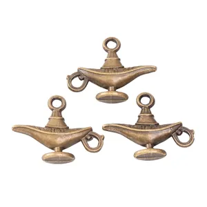 Three antique bronze Aladdin lamp charms for DIY jewelry making with retro relief patterns