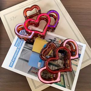 Amber resin heart-shaped hair claw clip with colorful pink and purple contrast edges