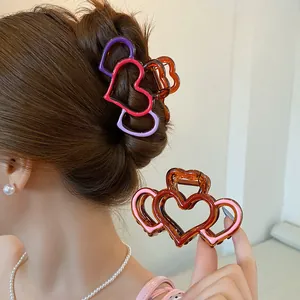 Elegant layered heart bow hair claw clip in purple and amber acrylic for long hair