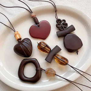 New Chinese Style Retro Geometric Resin Wood Pendant Necklace For Women Hollow Heart Flower Accessory Long Sweater Chain