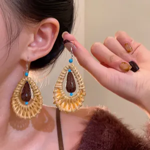 Bohemian rattan waterdrop earrings with wooden beads and blue accents for summer beach vacation