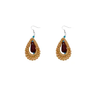 Bohemian rattan teardrop earrings with wood bead and blue accents for summer beach style