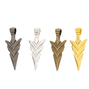 Set of four vintage alloy arrow pendants in gun black, silver, bronze, and gold finishes