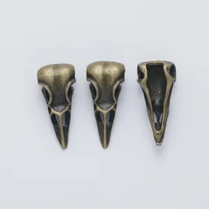 Vintage bird skull alloy pendants for DIY jewelry with antique bronze finish and hollow back