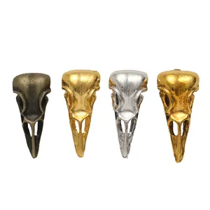 Vintage bird skull alloy pendants in bronze, gold, and silver finishes, four-piece set