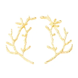 Golden branch-shaped alloy jewelry connectors for DIY crafting on a white background