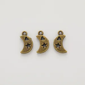 Three bronze crescent moon pendants with hollow star and heart designs for DIY jewelry
