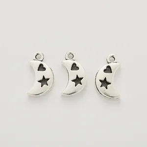 Three vintage silver crescent moon pendants with hollow heart and star patterns for DIY jewelry