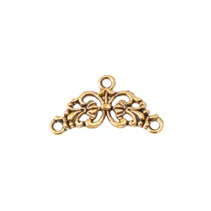 Macro detail of vintage bronze flower connector with three hanging holes for jewelry DIY