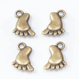 Set of four vintage zinc alloy baby feet charms in antique bronze finish for DIY jewelry