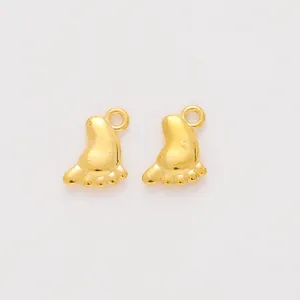Golden zinc alloy baby feet charms for DIY jewelry making in a minimalist metal design