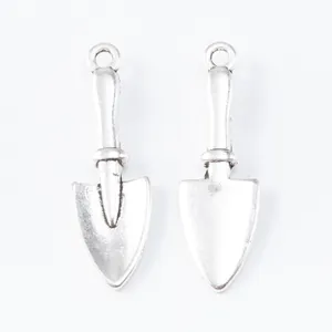 Vintage silver zinc alloy shovel charms for DIY jewelry making with front and back views