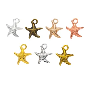 Set van zeven vintage legering zeester bedeltjes in diverse metalen afwerkingen voor DIY