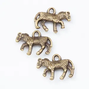 Set of 3 vintage bronze zebra pendants with detailed stripes for DIY jewelry making