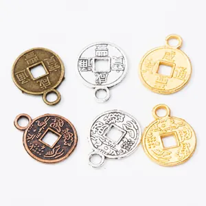 Macro view of vintage round coin charms with Chinese characters and dragon patterns