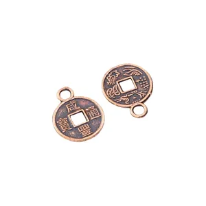 Detail of vintage bronze coin pendants with Xianfeng characters for DIY jewelry making