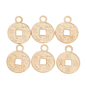 Detailed macro view of vintage zinc alloy Chinese coin pendants with hanging loops