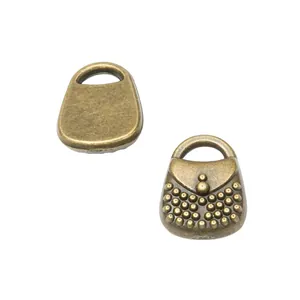 Pair of vintage bronze alloy handbag pendants for DIY jewelry making accessories