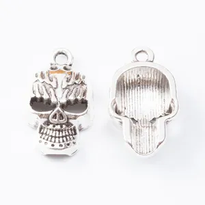 Vintage silver skull charms in zinc alloy, front and back view for DIY jewelry making