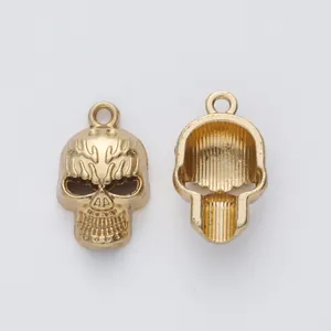 Detailed front and back view of gold skull charms for DIY jewelry making accessories