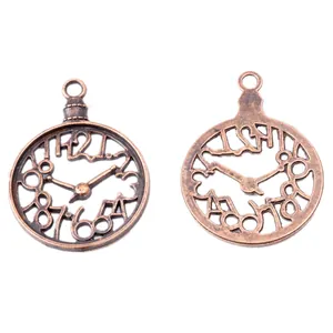 Macro shot of vintage bronze clock pendants with hollow design for DIY jewelry making