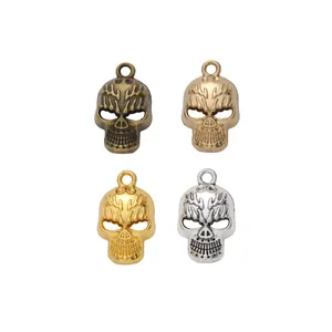 Set of four skull pendants in bronze, gold and silver finishes for DIY jewelry making